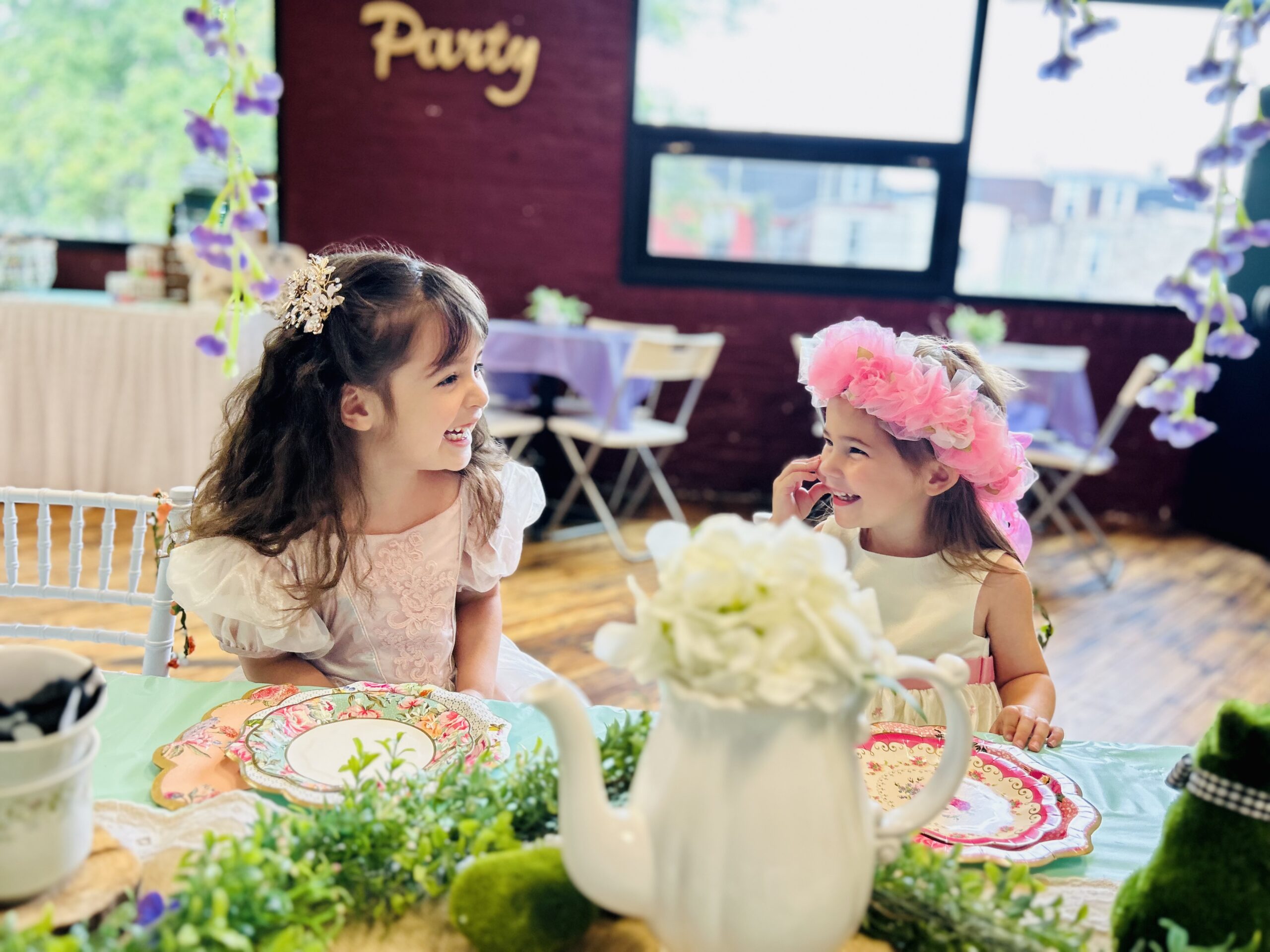 Tiny Town birthday party setup with kids and families